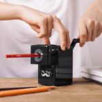 person using pencil sharpener